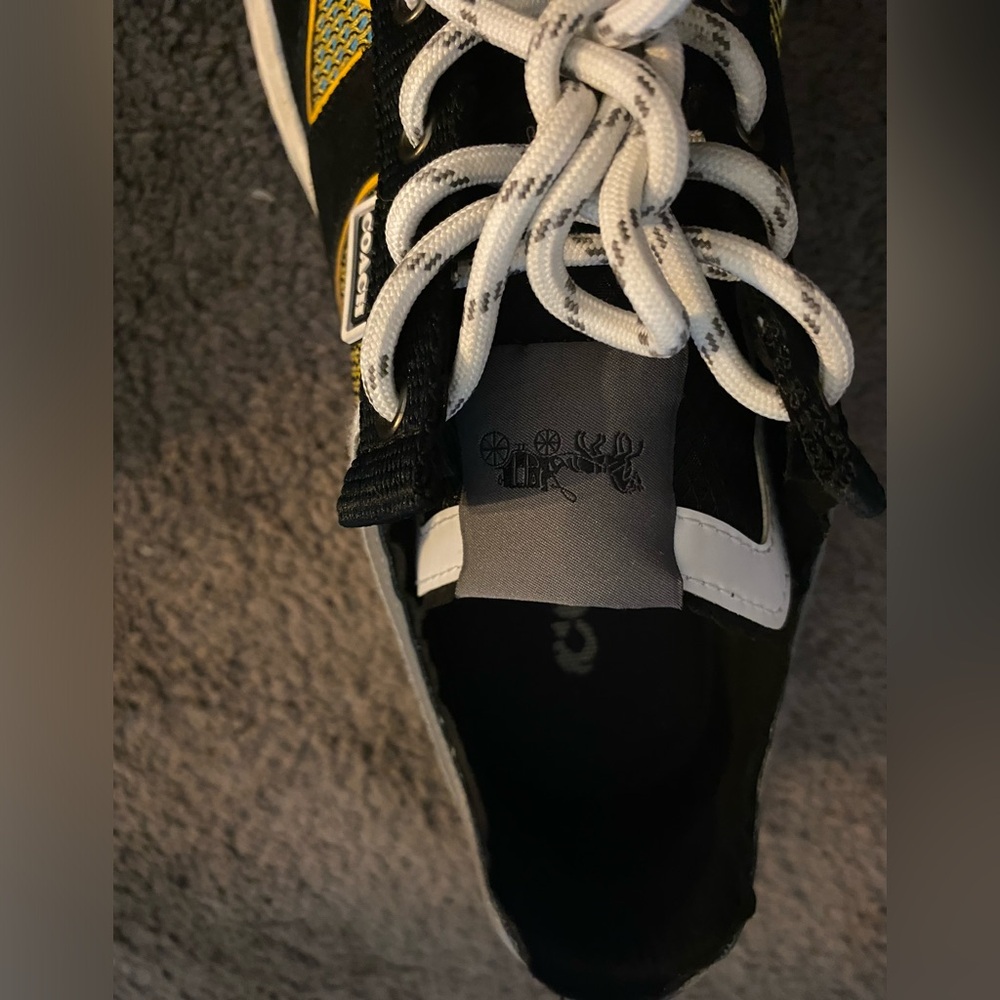 Yellow and black coach shoes